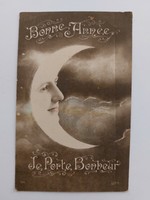 Old Christmas postcard 1916 postcard moon with a woman's face