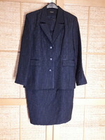 Two-piece women's suit with a long blazer with a funny neckline