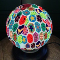 Argentinian millefiori pattern resin-coated glass table lamp with a wooden base