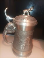 Pewter cup with elephant tongs