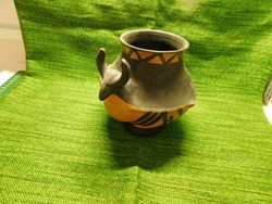 Black ceramic jug with a bull's head