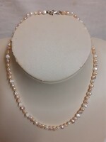 Nice condition genuine pearl necklace with silver clasp.