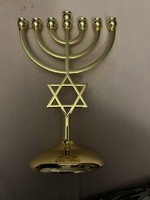 Menorah seven-branched Jewish candle holder. It was left to me as an inheritance. A very nice gift item. Brand new………..
