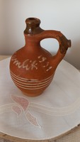 Old earthenware rattle jug, with the inscription 