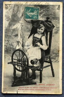 Antik  üdvözlő fotó képeslap kisleány rokkával