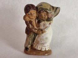 Glazed beautiful ceramic figurine xx depicting a small love couple. From the second half