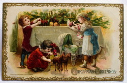 Antik dombornyomott  Karácsonyi  képeslap gyermekek karácsonyfa játékok baba katonák lovas kocsi