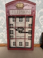 Decorative wall clock reminiscent of an antique telephone booth