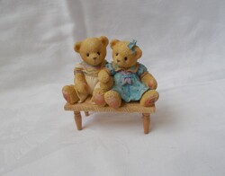 Lifelike, special, unique teddy bear figure on a pair of benches, a piece suitable for a collection