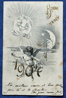 Antik Újévi üdvözlő grafikus képeslap  angyalka 1904 évszám nap és hold gomolyagot készít