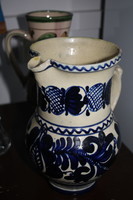 Blue jug with flower pattern (such as Michael Korund)