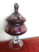 A large burgundy crystal stand with a bonbonier lid
