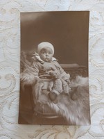 Old baby photo toy teddy bear