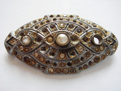 Old women's brooch with vintage metal badge