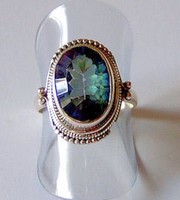 Mystical topaz rings in blue and rainbow colors