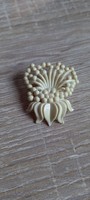 Old vinyl flower-shaped brooch