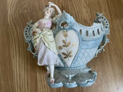 Wonderful antique biscuit basket with a floral lady and pierced ears.