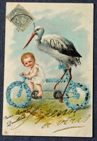 Antik grafikus üdvözlő glitteres képeslap  baba gólyával nefelejcs kerékpáron