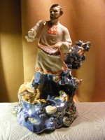 Korosten Ukrainian porcelain figurine - sadko plays a gusli plucked instrument in the depths of the sea