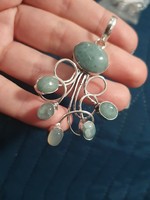 A wonderful aquamarine pendant set in silver, in a unique style
