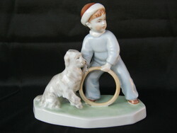 Zsolnay is a little boy playing with a porcelain dog