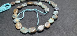 Peruvian opal faceted string of beads.