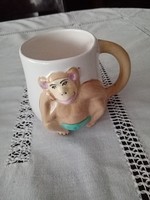 Tea/coffee/beer ceramic mug with a cute, cheeky monkey decoration in relief