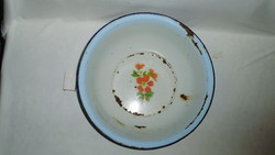 Old, flowery, pale blue edged enamel bowl marked 