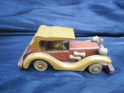 Carved from wood, old timer car, richly detailed, painted in color. A rare piece.