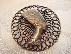 Old women's brooch with vintage metal badge