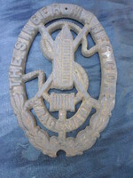 Cast iron crest, singer sewing machine logo. In the condition shown in the photo.