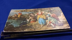 A beautiful old wallet depicting a scene from life