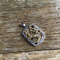 Silver pendant decorated with citrine stones