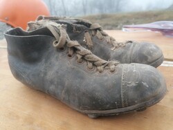 Very old leather football boots with cleats found in the attic