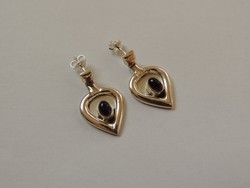 Unique designed silver earrings decorated with amethyst stone