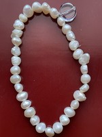 Real pearl bracelet with crystal pendant.