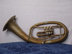 The large brass tuba instrument shown in the picture is for sale