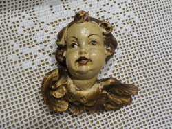 Old slightly worn but not damaged putto angel head.