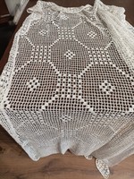 White hand-crocheted curtain, bedspread