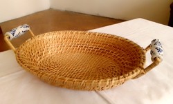 Old hand-woven cane with handles, fruit and bread storage basket with blue and white Delft porcelain tongs