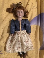 A beautiful doll with a porcelain head