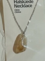 Citrine semi-precious stone mineral pendant with chain.