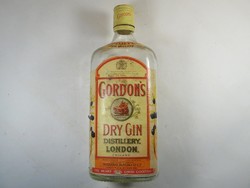 Old glass bottle with paper label - gordon's dry gin drink - 1980s
