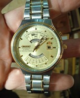 Orient men's automatic perpetual calendar watch, in working condition.
