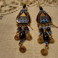 Earrings with an Aztec pattern.