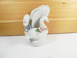 Retro old porcelain swan figure sculpture