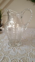 Old, engraved thick crystal water jug