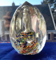 Old hand-polished paperweight with a female figure