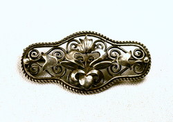 Historizing decorative old silver brooch