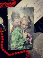 Antique postcard with a couple in love